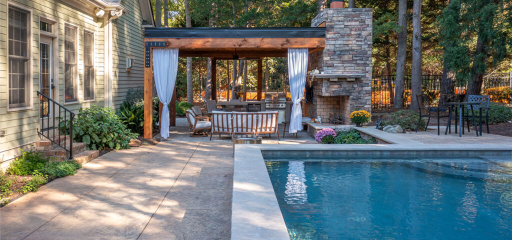 Wide shot of Trenton Woods project with home on the left, Pavilion in the center and pool on the right.