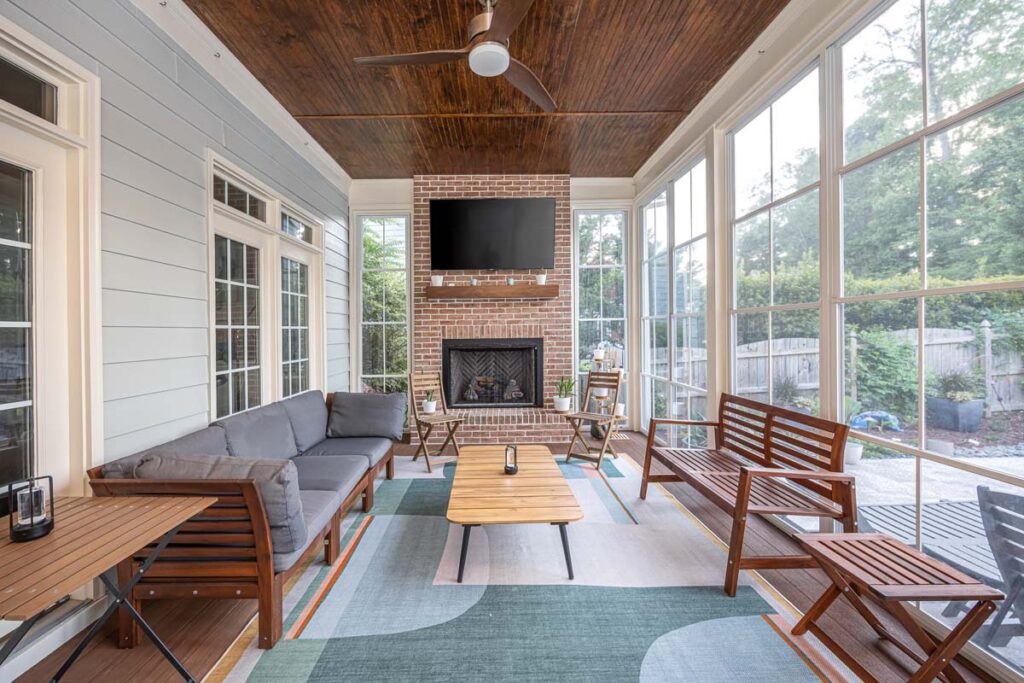 Interior view of Dominion indoor deck looking towards fire place and television area.