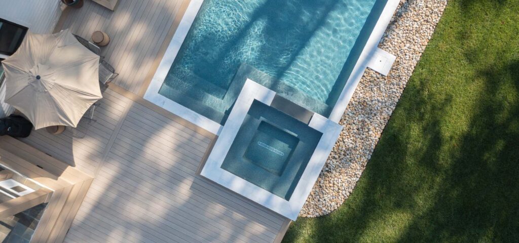 Top view of Royal Amber pool with composite deck surround from TimberTech.