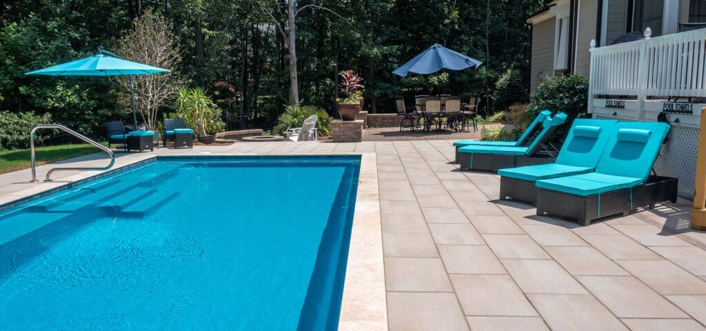 Vision pool and surrounds showing case custom-built pool, patio, and fire pit.